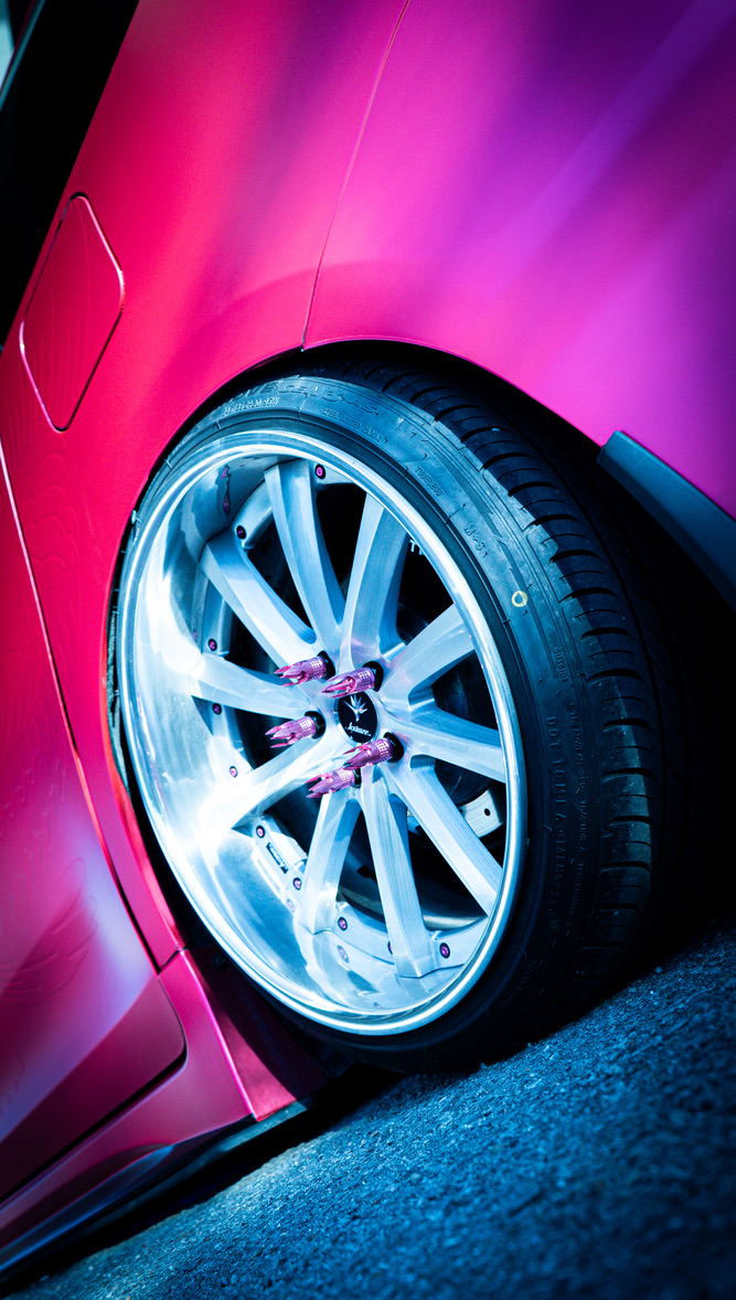 Polished wheel on a pink car
