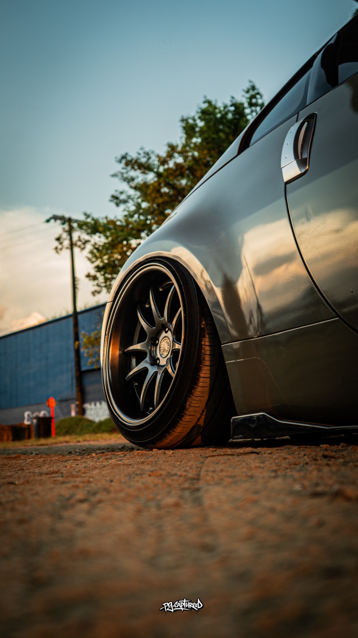 Low rear-quarter detail of a Nissan 350Z