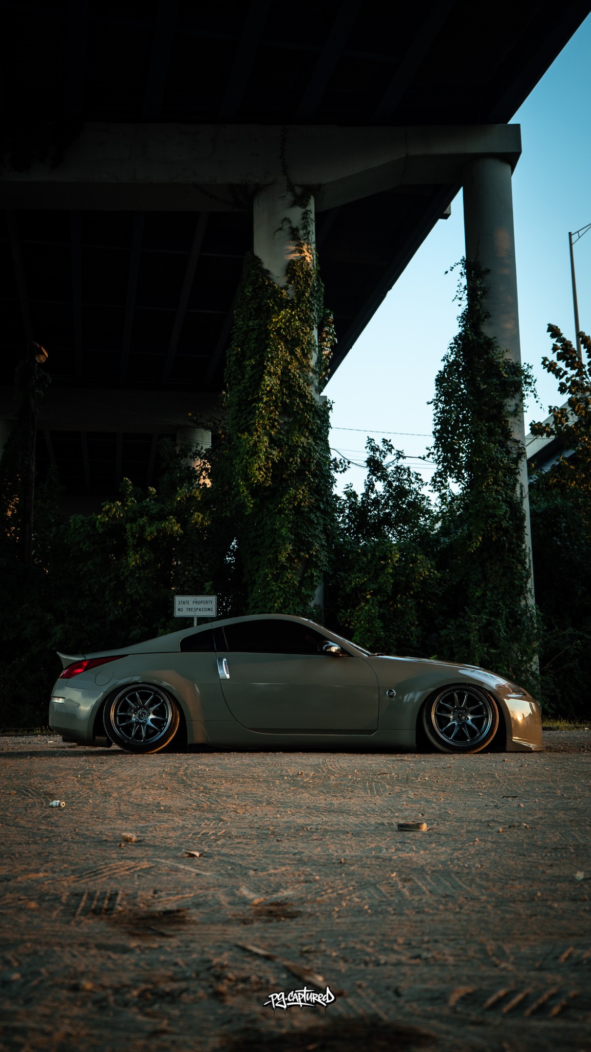 Lowered Nissan 350Z photographed beneath an overpass